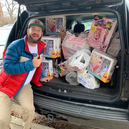 The Freebie Guy shows off a carload of toys he's purchased on sale for children in need.