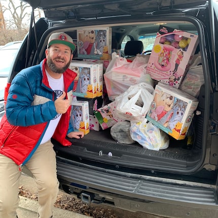 The Freebie Guy shows off a carload of toys he's purchased on sale for children in need.