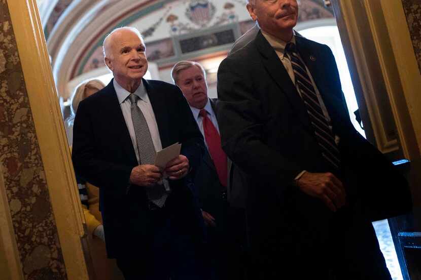 Senator John McCain (R-AZ) leaves after a procedural vote on healthcare on Capitol Hill July...