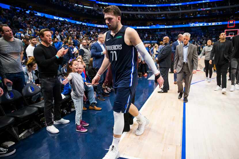 FILE - Mavericks guard Luka Doncic (77) leaves the court after a game against the Pacers on...