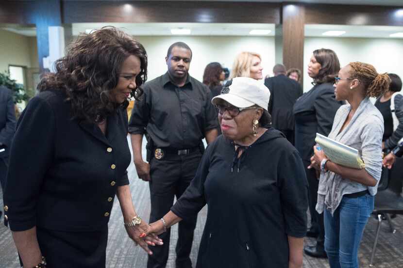 Dallas County District Attorney Faith Johnson, left, speaks with Vera Williams following a...