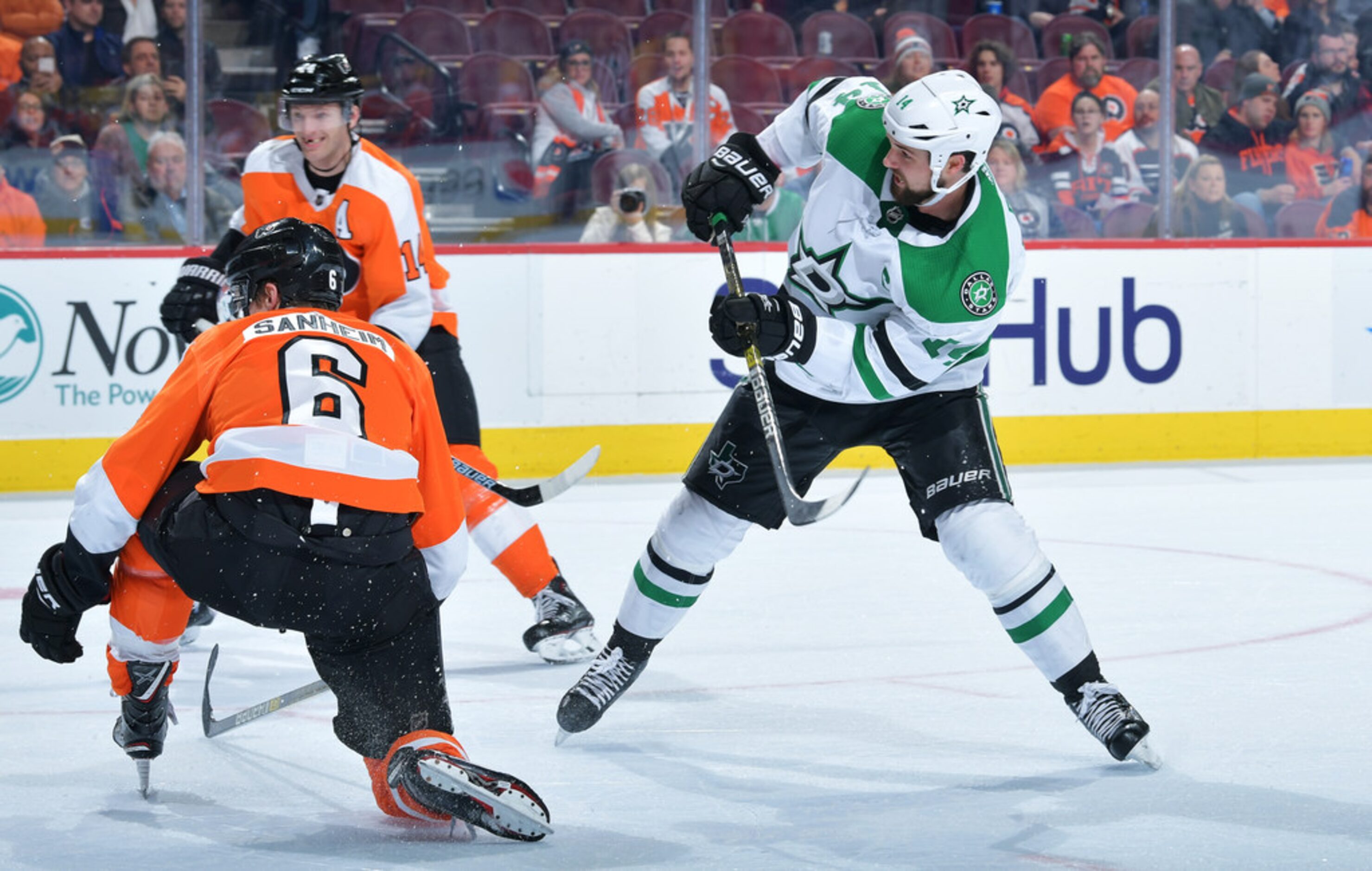 PHILADELPHIA, PENNSYLVANIA - JANUARY 10: Jamie Benn #14 of the Dallas Stars deflects the...