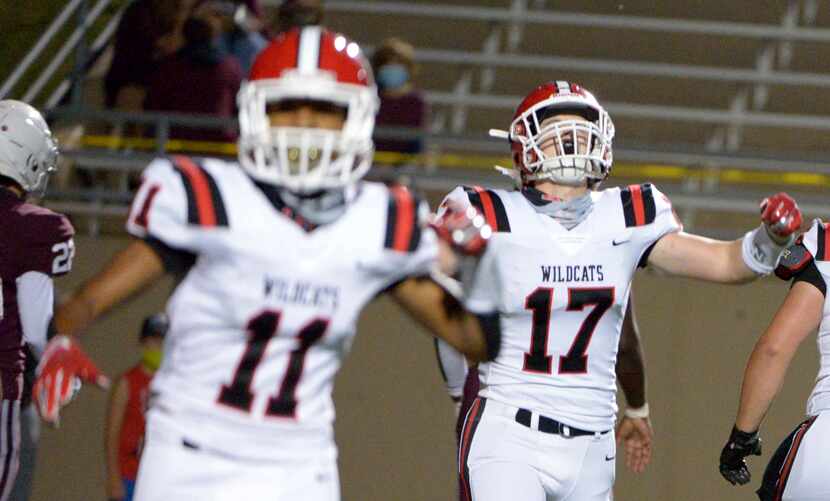 Lake Highlands Will Hutton (17) and Shamar Donaldson (11) celebrate a touchdown in the first...