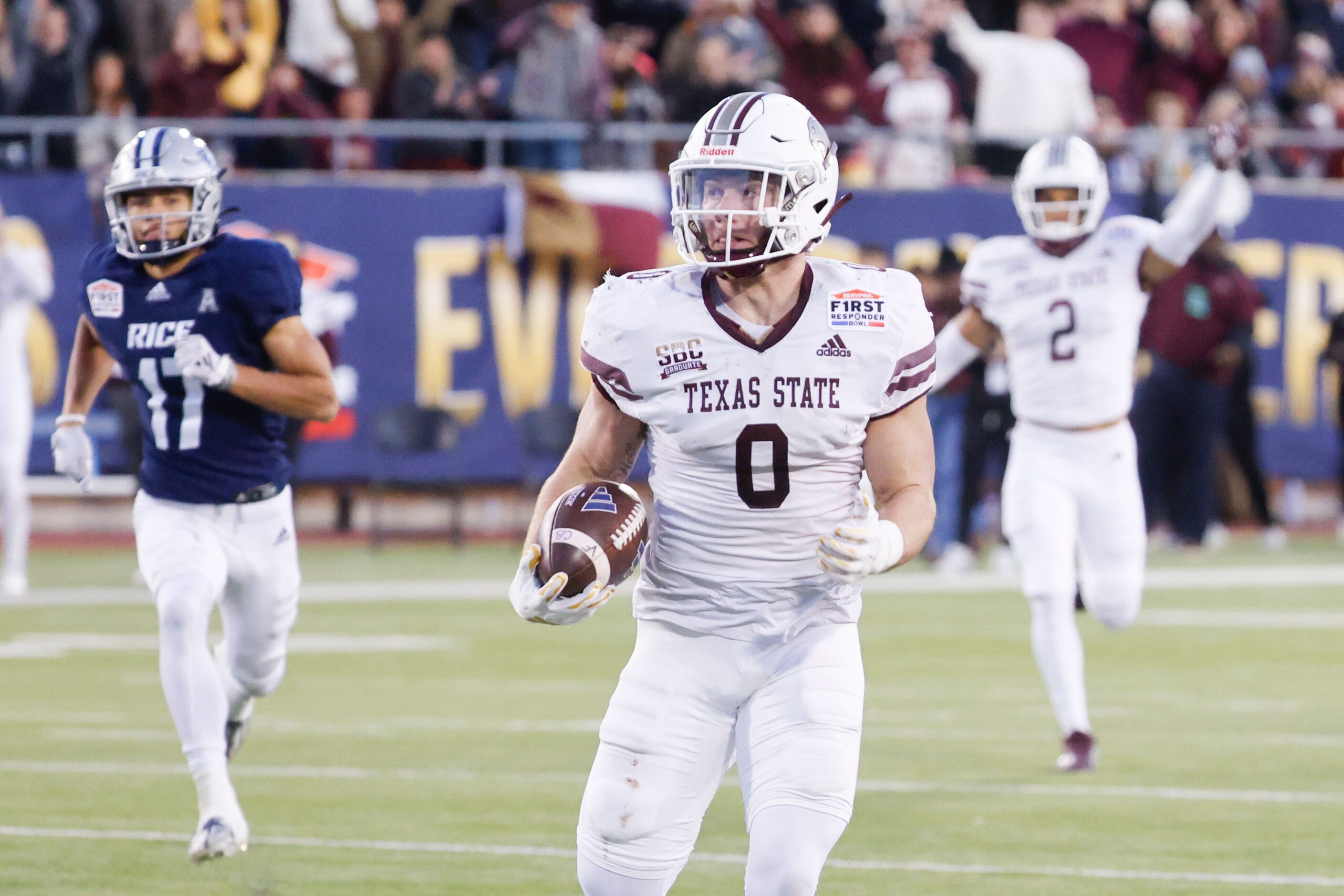 Texas State linebacker Brian Holloway (0) looks as he runs after a pick six during the first...