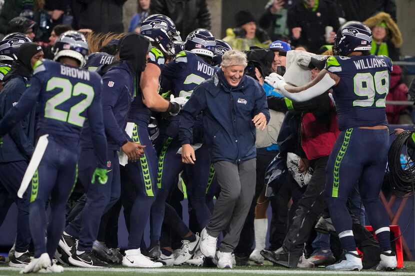 Seattle Seahawks head coach Pete Carroll reacts as players gather during the second half of...