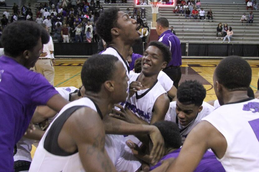 Dallas Lincoln players took to center court to celebrate their 67-66 victory over Dallas...