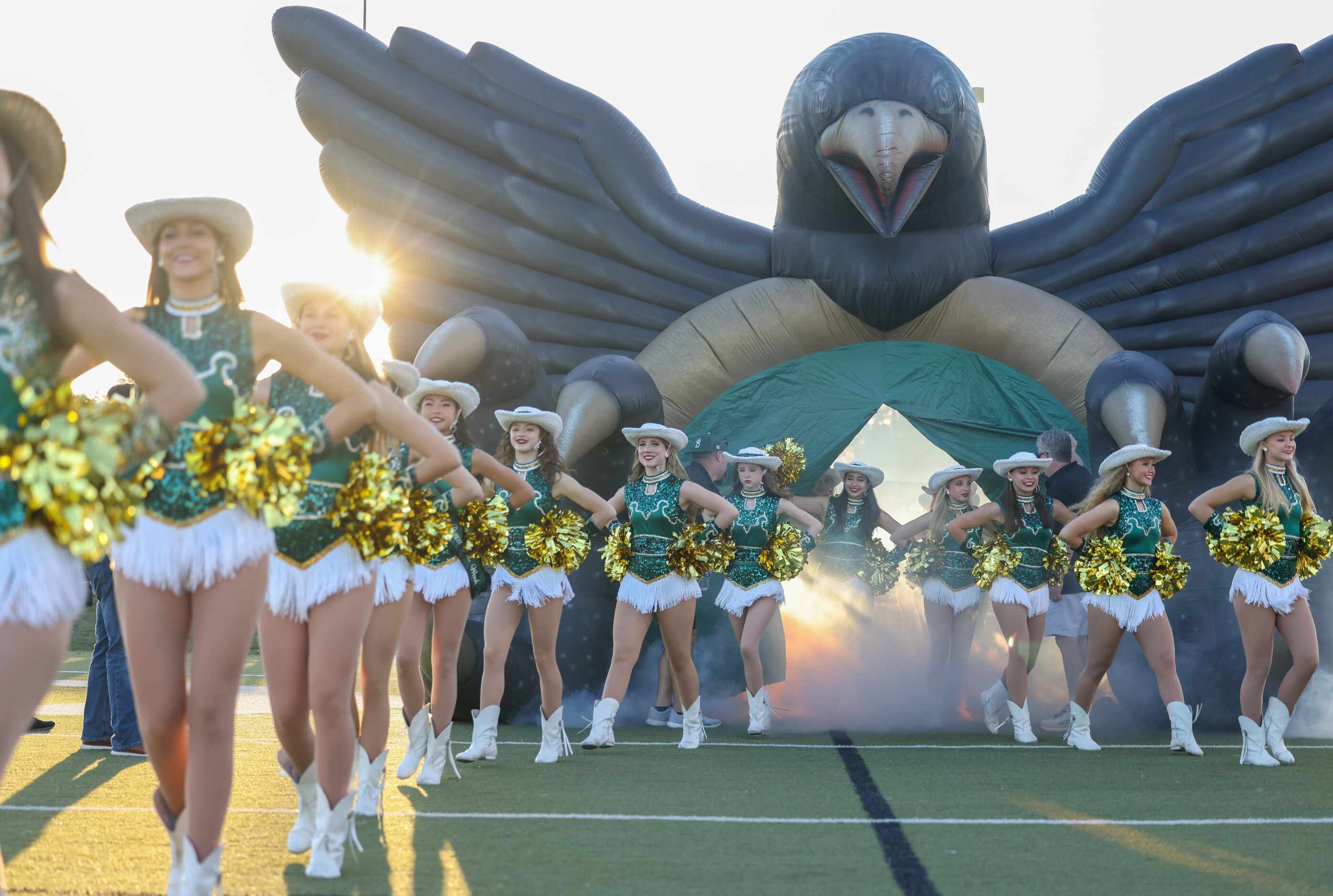 Birdville’s drill team enters the field ahead of their team at the start of a game against...