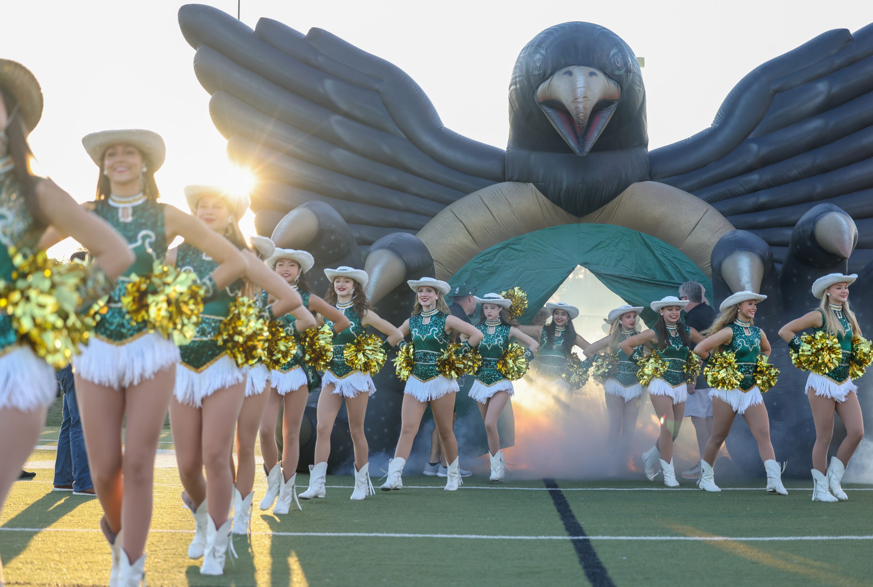 Birdville’s drill team enters the field ahead of their team at the start of a game against...