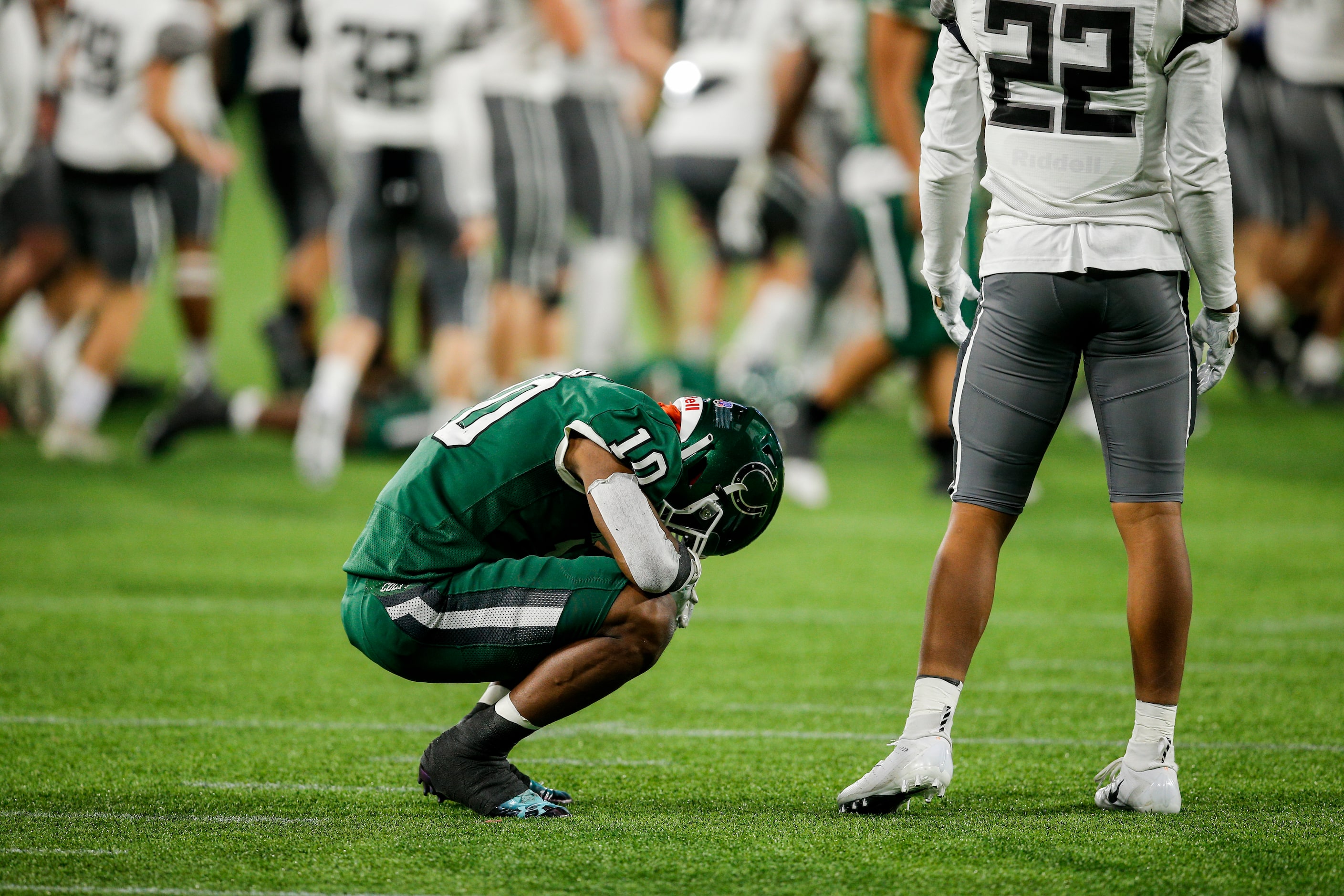 Arlington senior wide receiver Joel Murray (10) reacts after falling 38-31 in double...