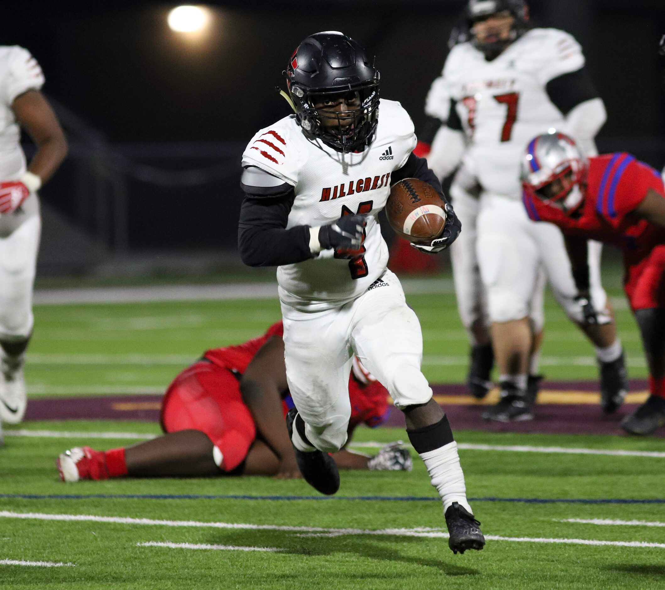 Hillcrest running back Nasir Reynolds (4) runs the ball during the first half against Spruce...