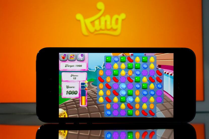 The King Digital Entertainment logo and "Candy Crush Saga" game are displayed on an Apple...