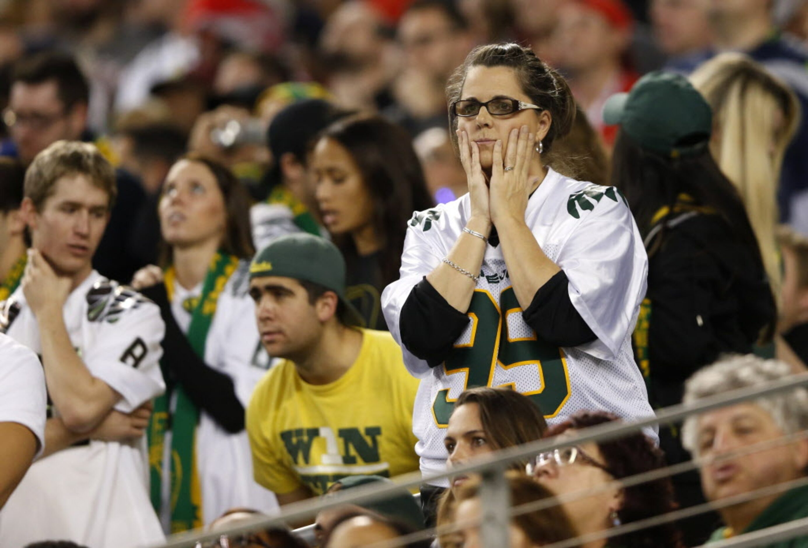 Dejected Oregon Ducks fan late in the second half of the College Football Playoff National...