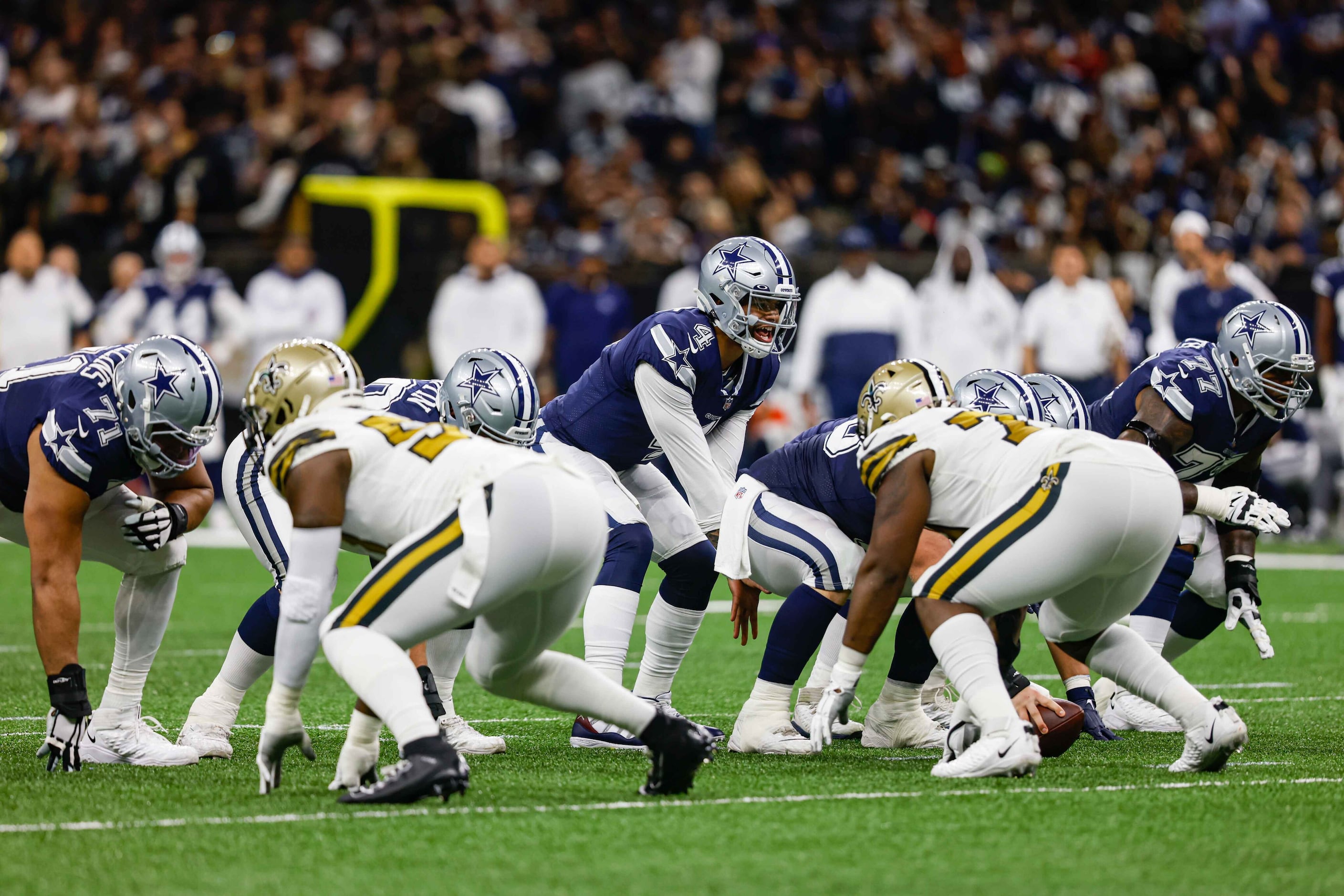 Dallas Cowboys quaterback Dak Prescott (4) runs a play during a game against New Orleans...