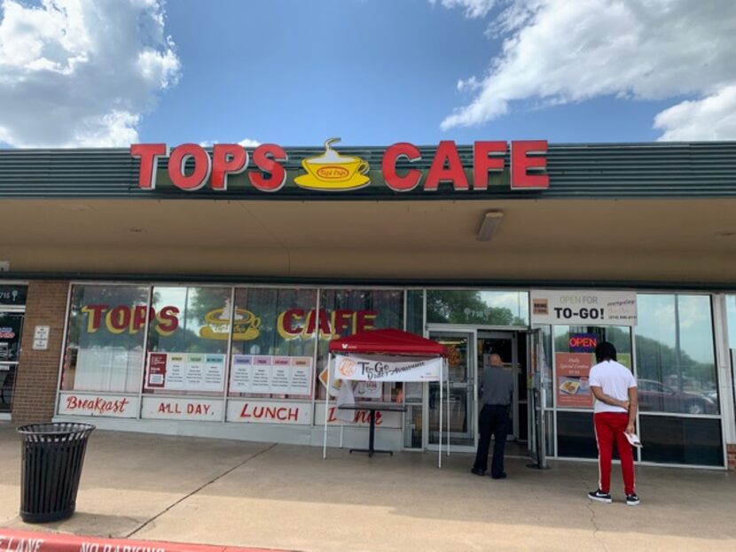 Customers wait for their orders on Catfish Friday at Tops in Wynnewood Village.