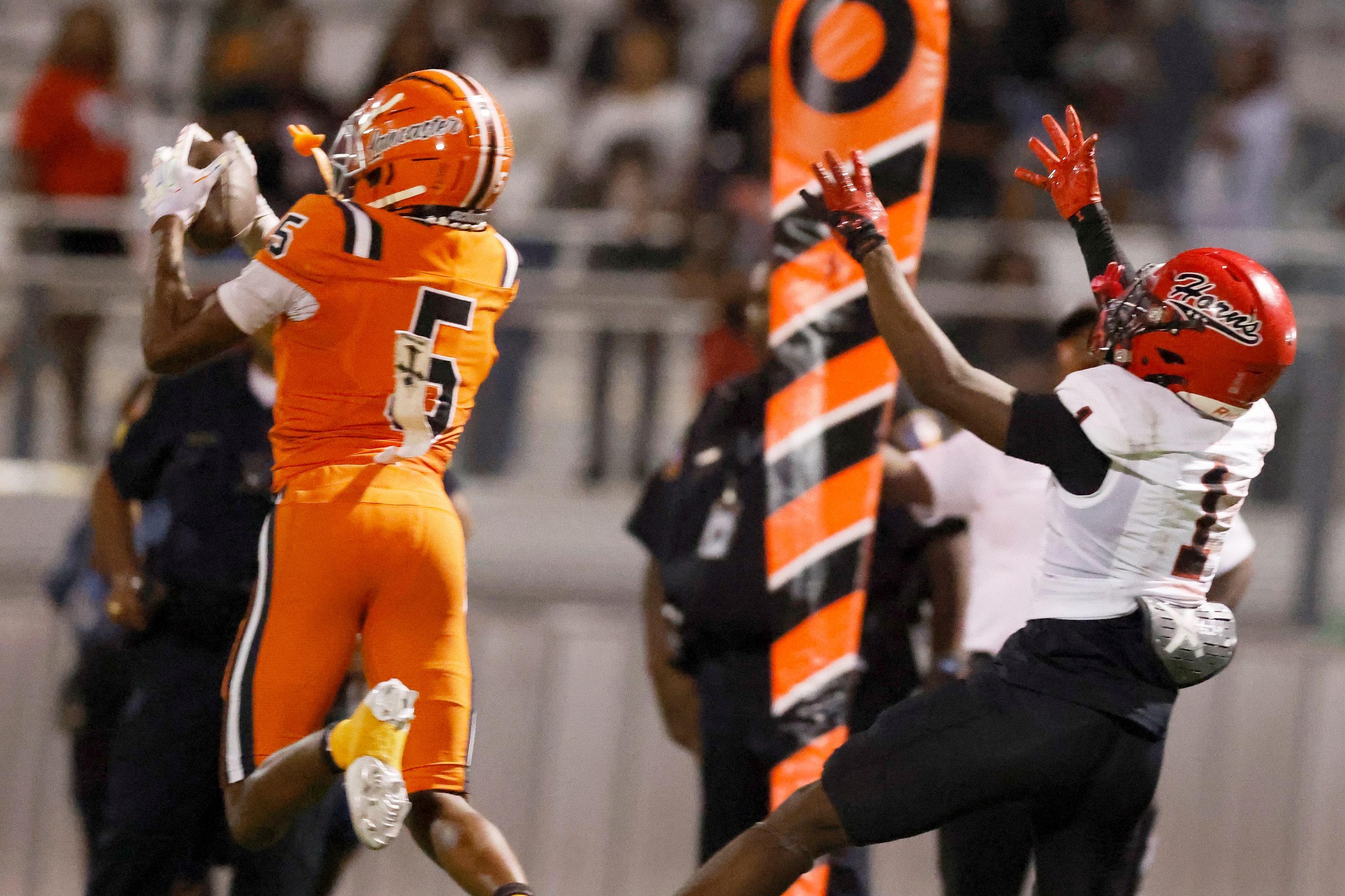 Lancaster defensive back Braylan McDonald (5) intercepts a pass intended for Cedar Hill wide...