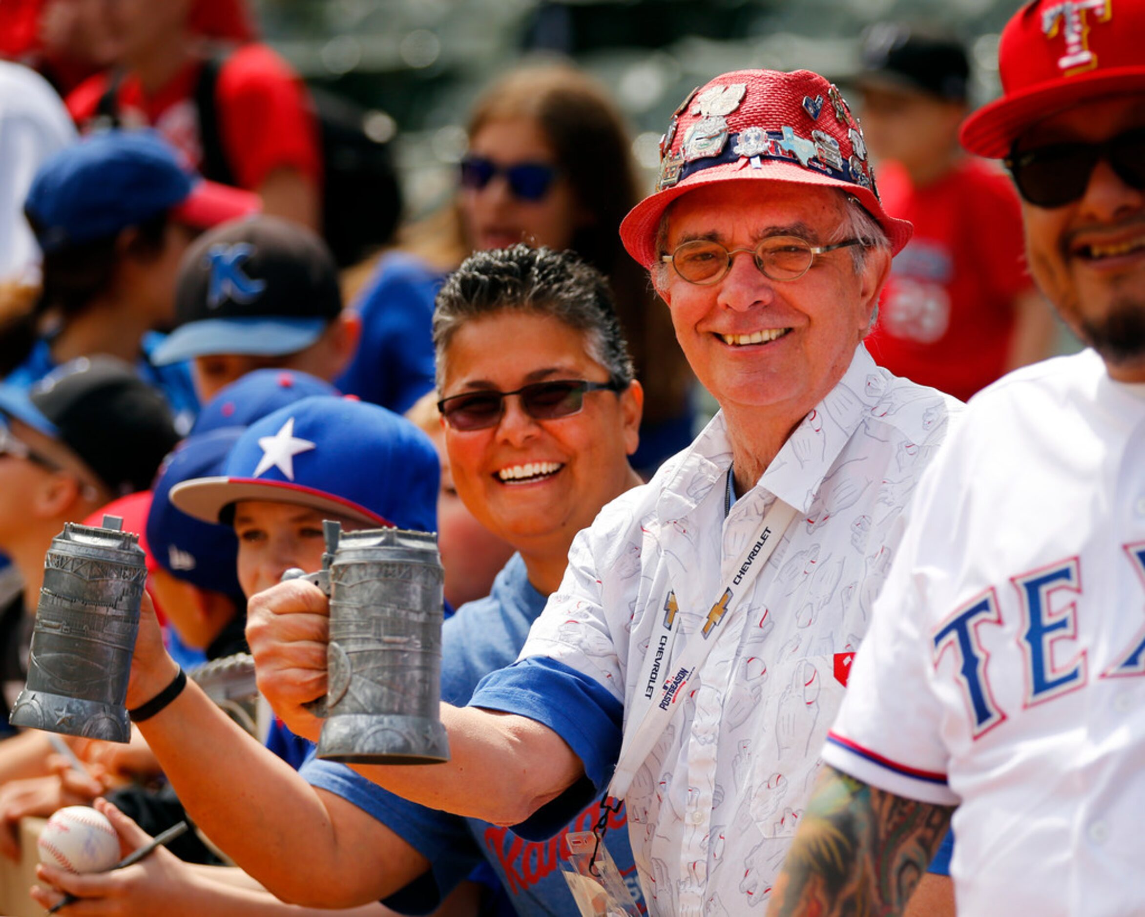 Texas Rangers fans Dana Story of Duncanville, Texas (2nd from right) and Stephanie Flores of...