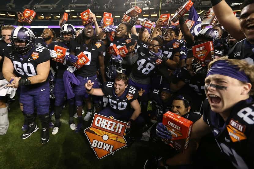 TCU players celebrate a 10-7 overtime win against California in the Cheez-It Bowl NCAA...