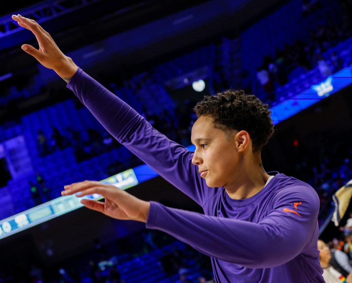 Phoenix Mercury center Brittney Griner waves bye to fans after a game against the Dallas...