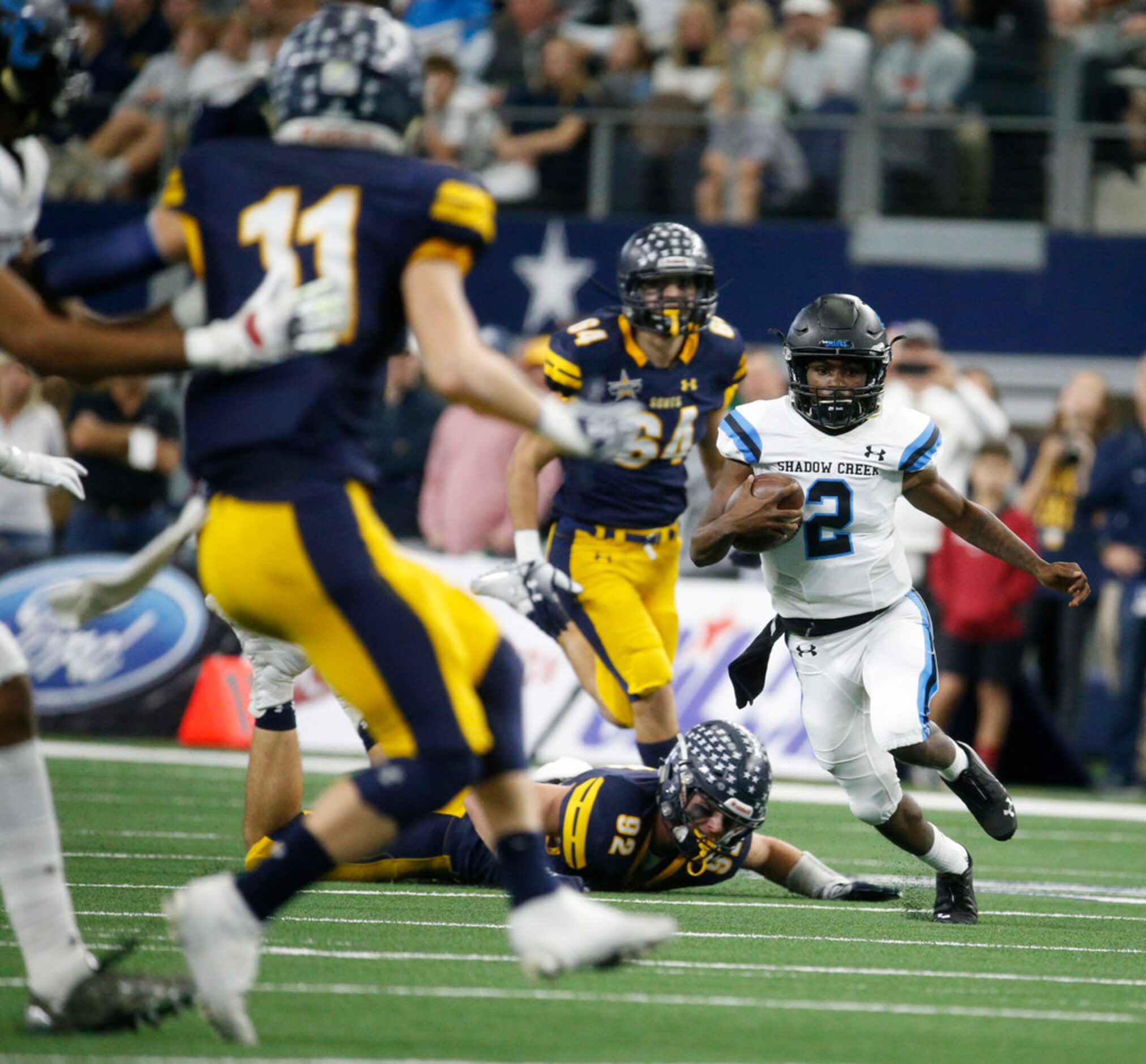 Shadow Creek's quarterback Jamarian George runs the ball against Highland Park during the...