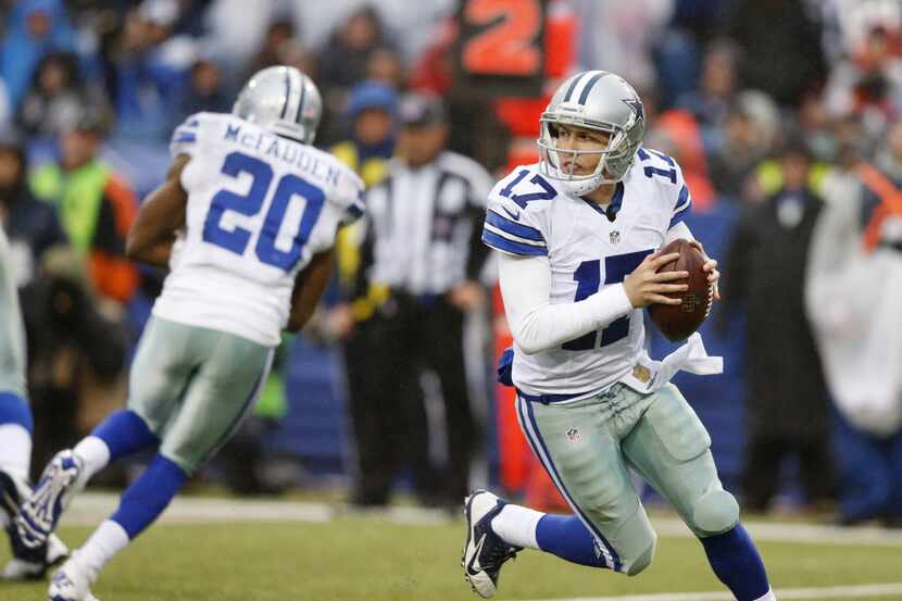 Dallas Cowboys quarterback Kellen Moore (17) scrambles out of the pocket during the second...