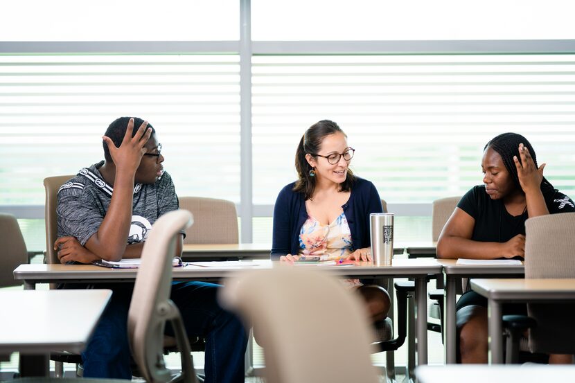 Student Darrius Chamblee (left), 826 volunteer Brittnay Connor (center) and student Juliet...