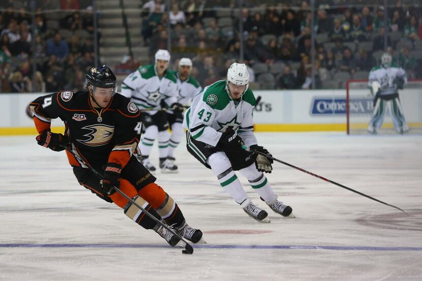 DALLAS, TX - NOVEMBER 26:  Cam Fowler #4 of the Anaheim Ducks skates the puck against Valeri...