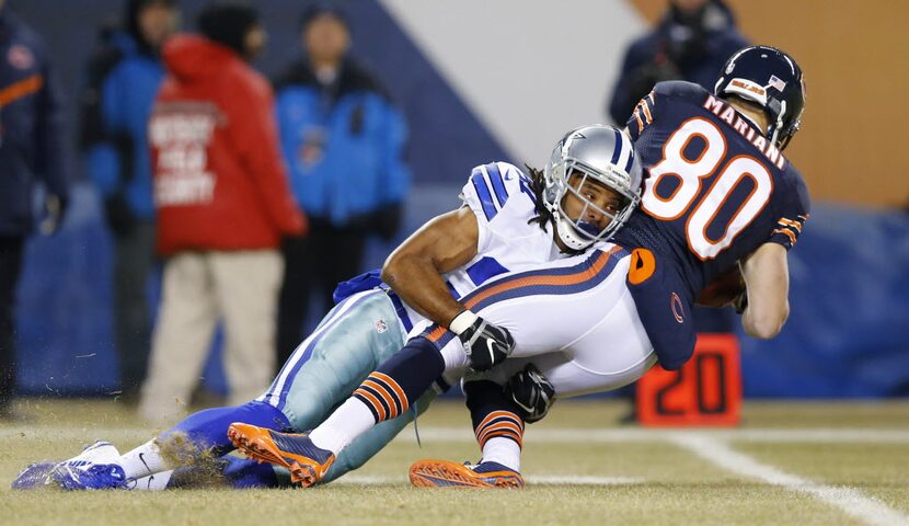 Dallas Cowboys defensive back C.J. Spillman (37) tackles Chicago Bears punt returner Marc...