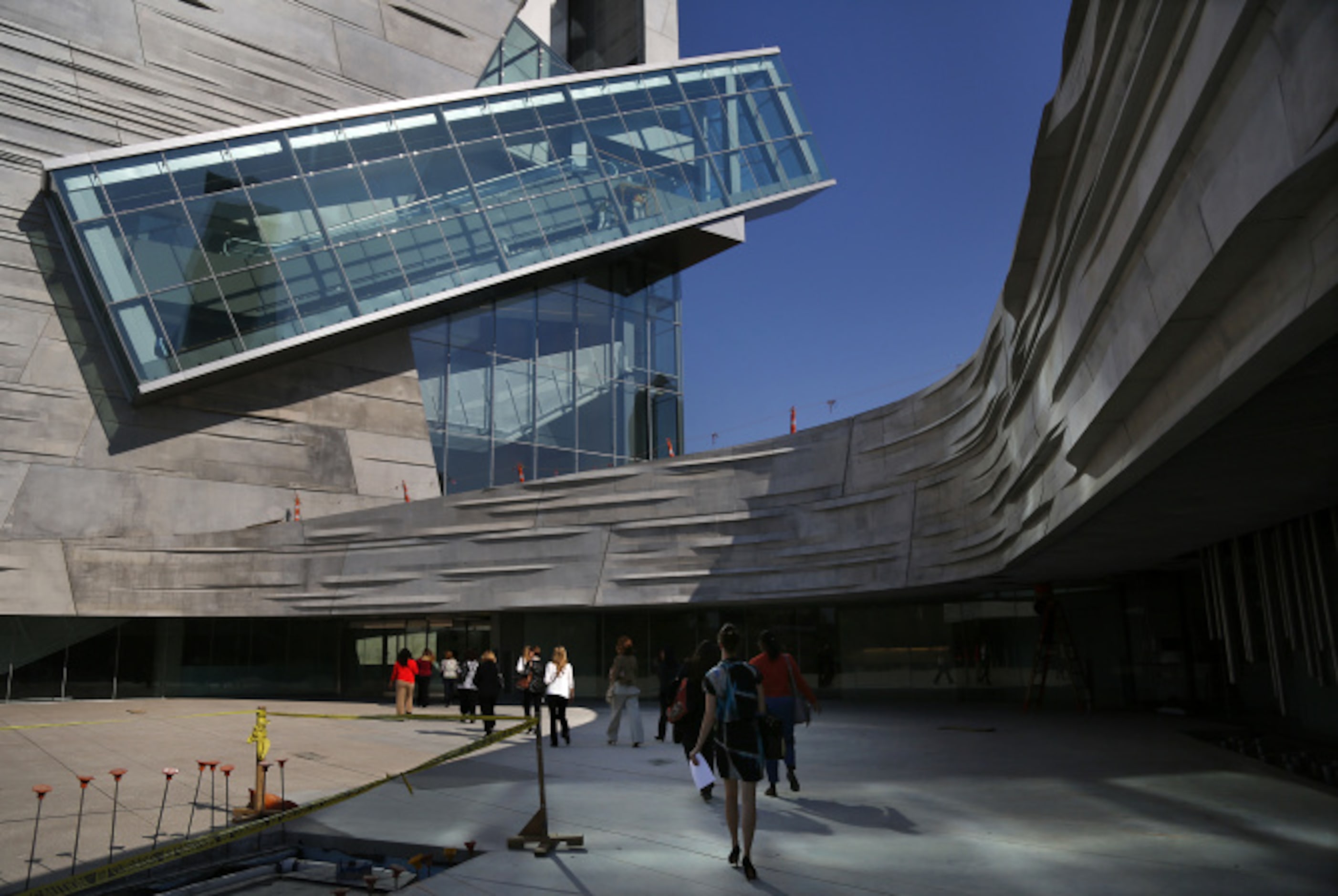 Guests enter the museum below the slanting escalator.