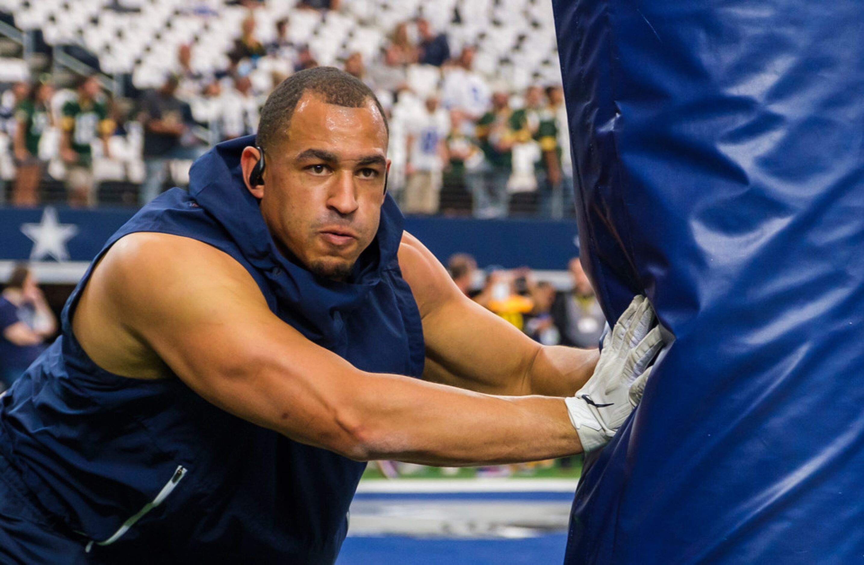 Dallas Cowboys defensive tackle Tyrone Crawford warms up before an NFL football game against...