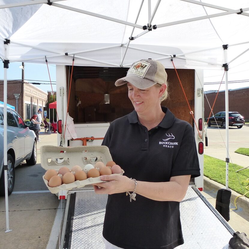 Mona Gregory holds up her Buck Creek Land and Cattle free-range eggs at Frisco Rotary...