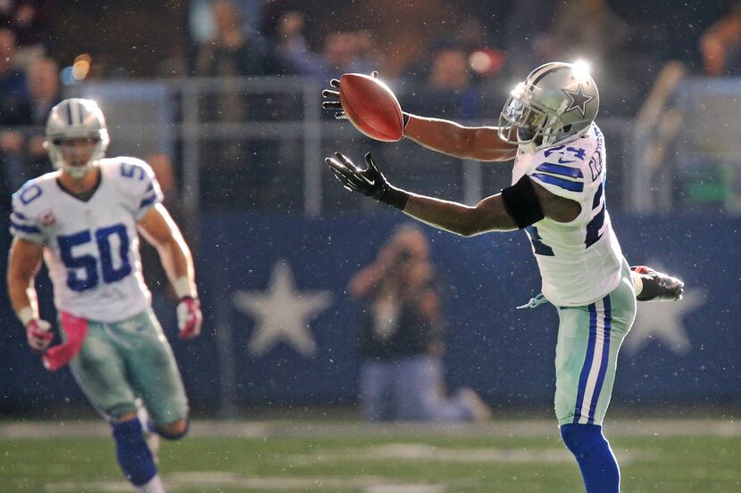 Dallas Cowboys cornerback Morris Claiborne (24) intercepts a Peyton Manning pass in the...
