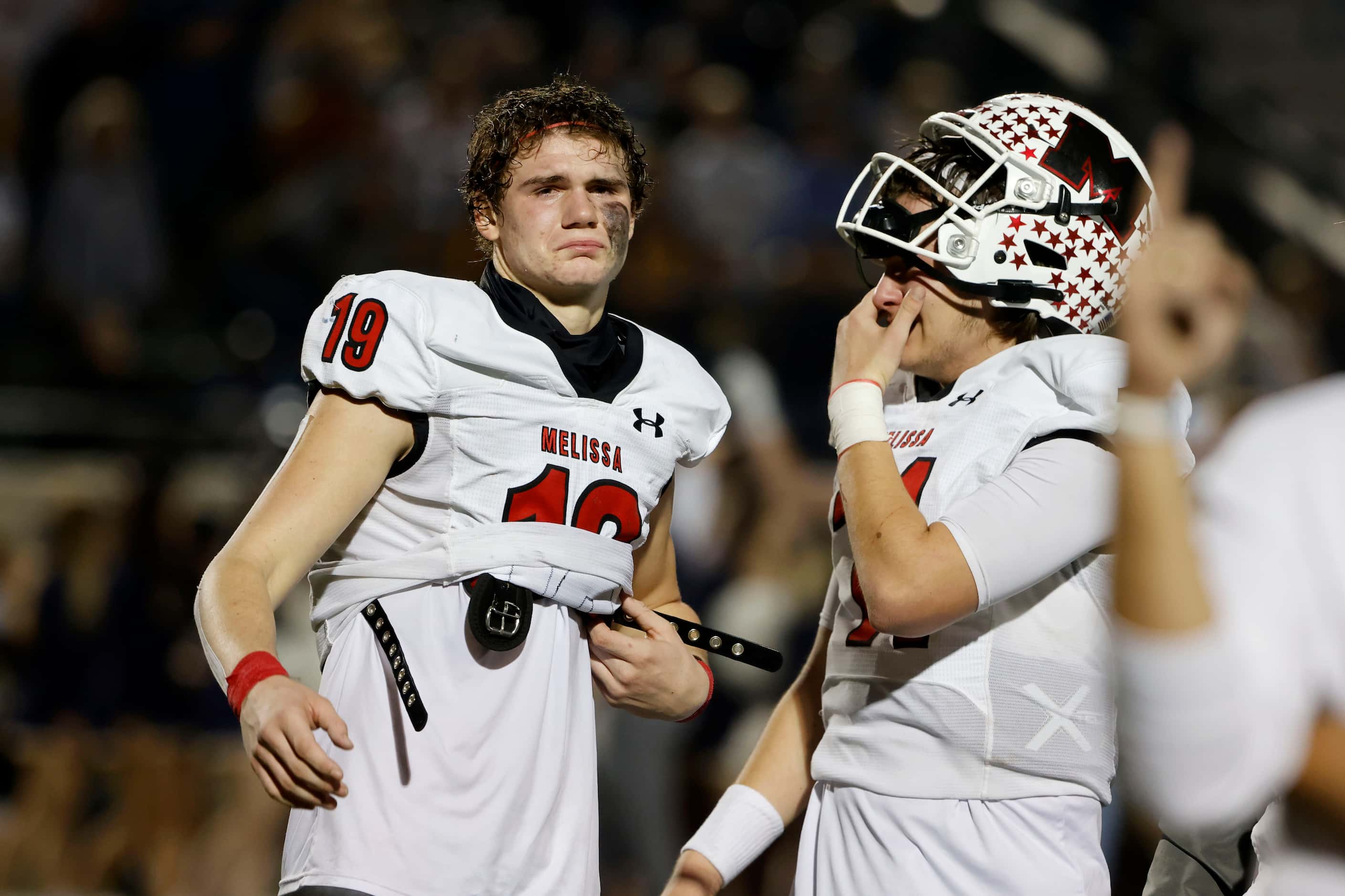 Melissa receiver Matthew Sanford and quarterback Sam Fennegan, right, react after losing to...