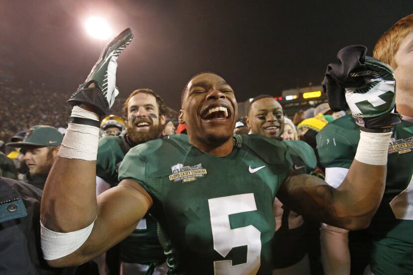 Baylor Bears wide receiver Antwan Goodley celebrates with his teammates and fans after the...