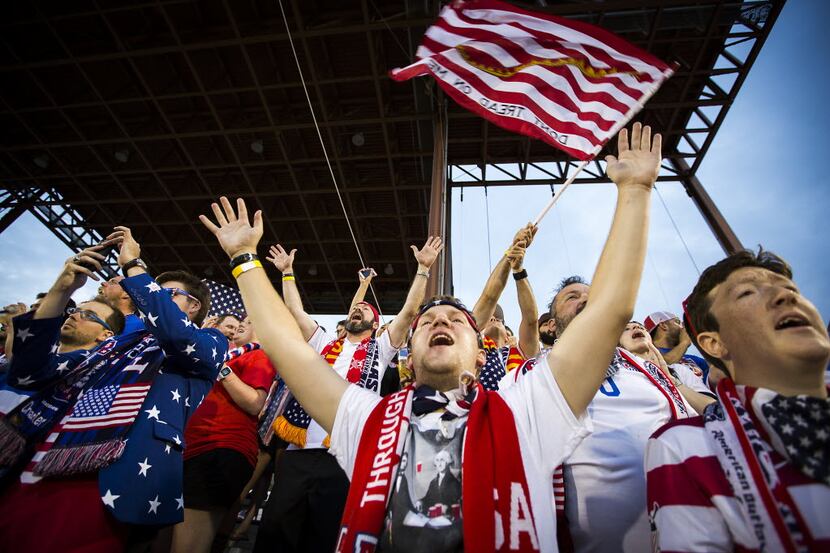 USA supporter Charlie Ostrovich of Coppell cheers a his team take the field to face Honduras...