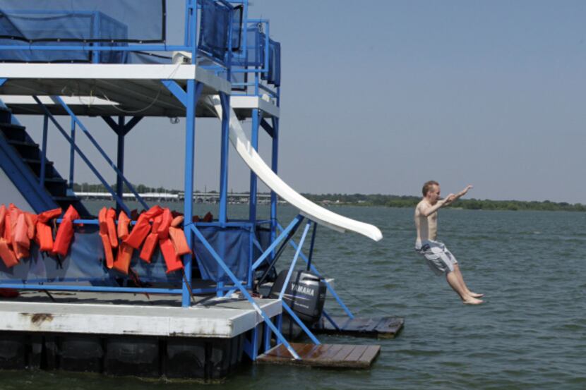 Samppa Lahtinen, 30, of Finland, enjoys a party boat with friends on Lewisville Lake on...