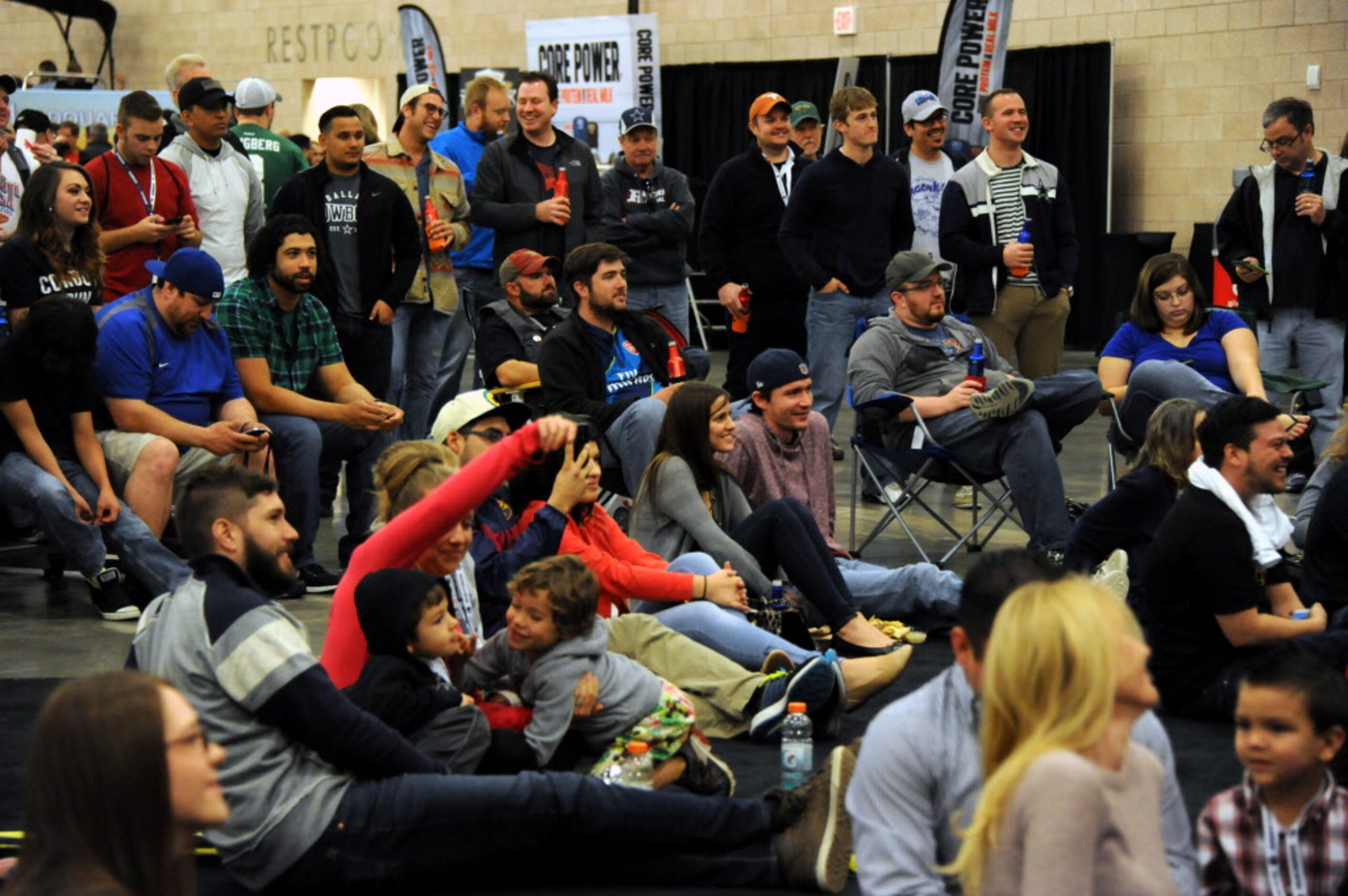 Guests watch their favorite radio hosts talk to Cowboys players at The Ticket Sportsradio...