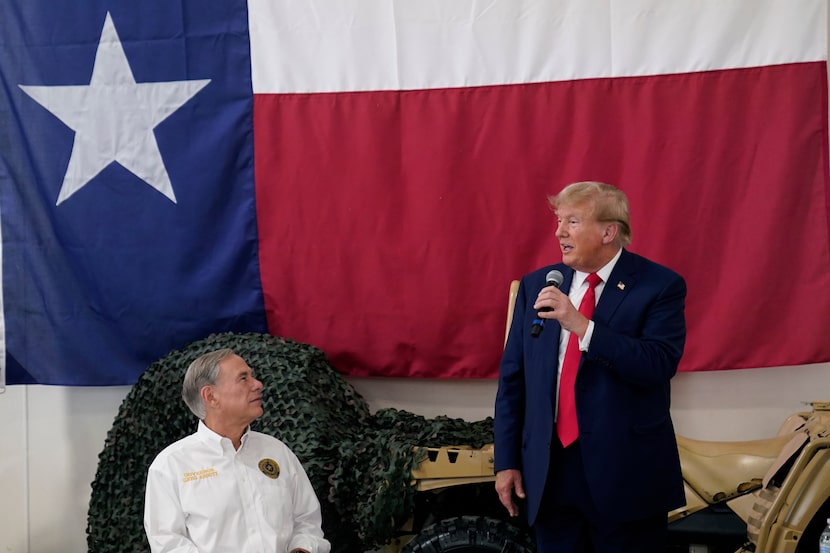 Texas Gov. Greg Abbott, left, listens as Republican presidential candidate and former...