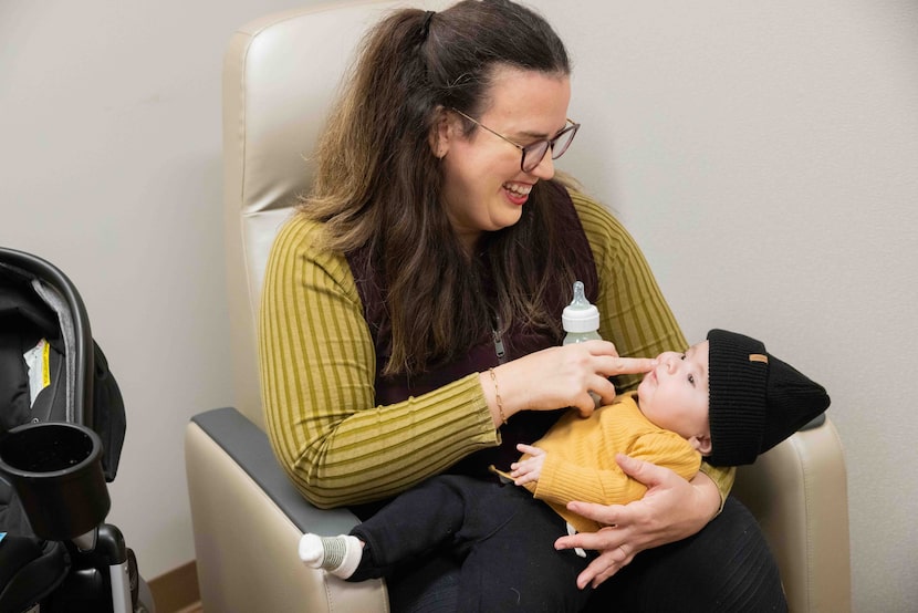 Martha Penturf holds her 4.5-month-old son Atlas, who had open heart surgery in November...