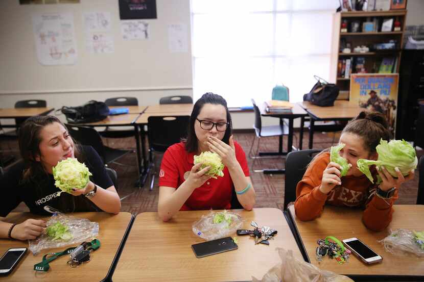 (From left) Seniors Cammy Rodriguez, Autumn Vidana and Steph Halsey react while eating their...