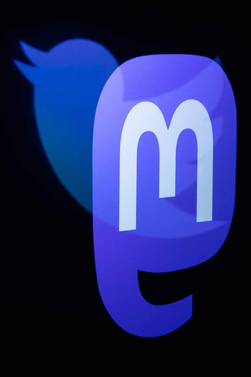 This photograph taken on Nov. 7 shows the logos of social networks Twitter and Mastodon...