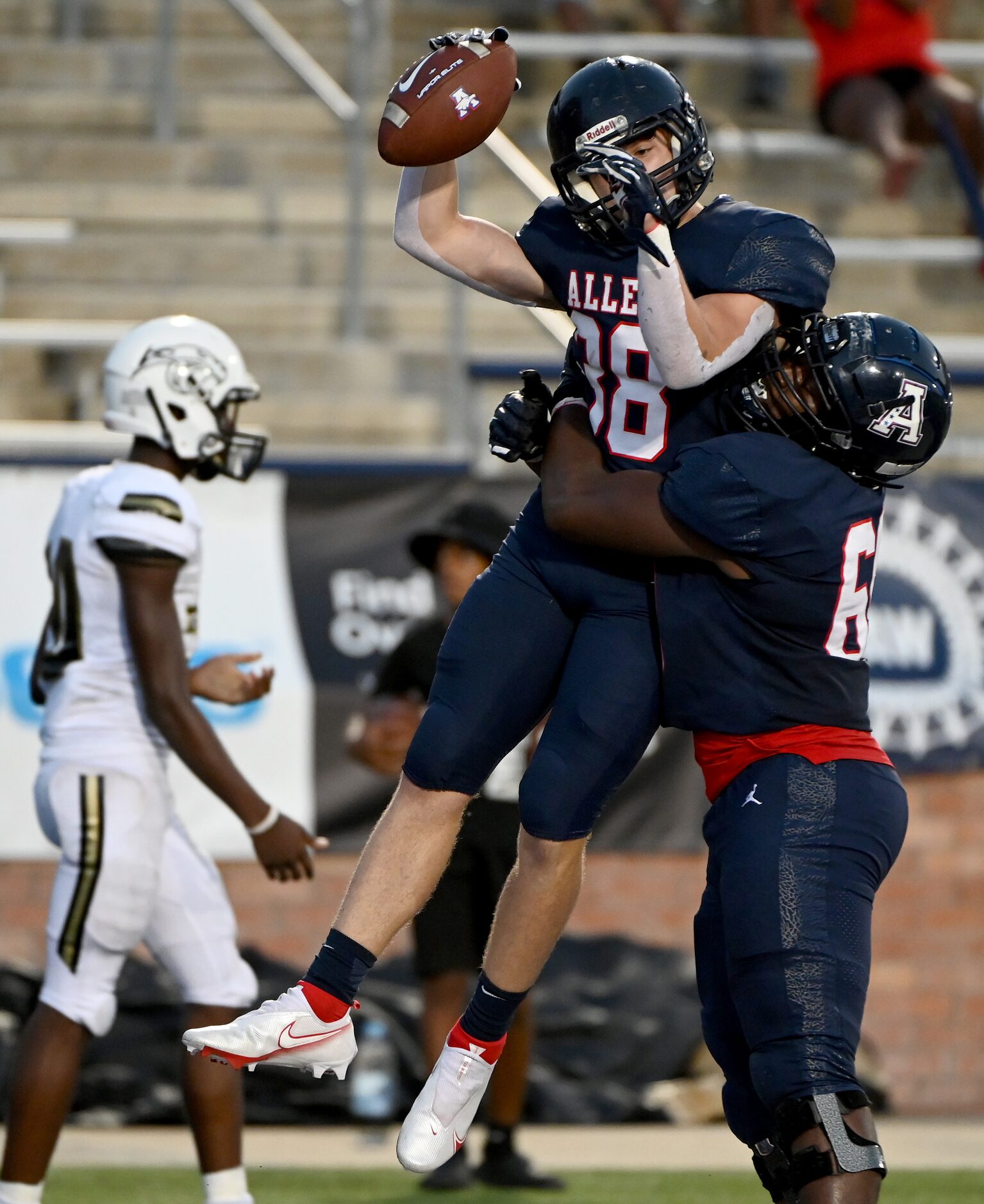 Allen’s Brennan Harvey (38) and Antony Harris celebrate a touchdown in the first half during...