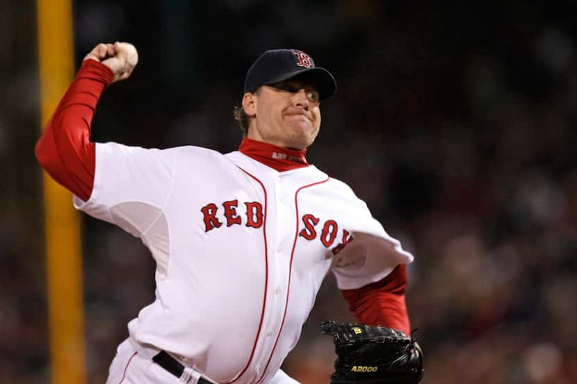 In this Oct. 25, 2007, file photo, Boston Red Sox's Curt Schilling pitches against the...