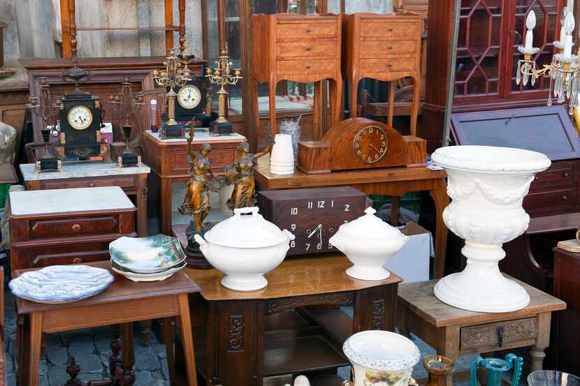 Antique furniture and housewares on display at a thrift store.