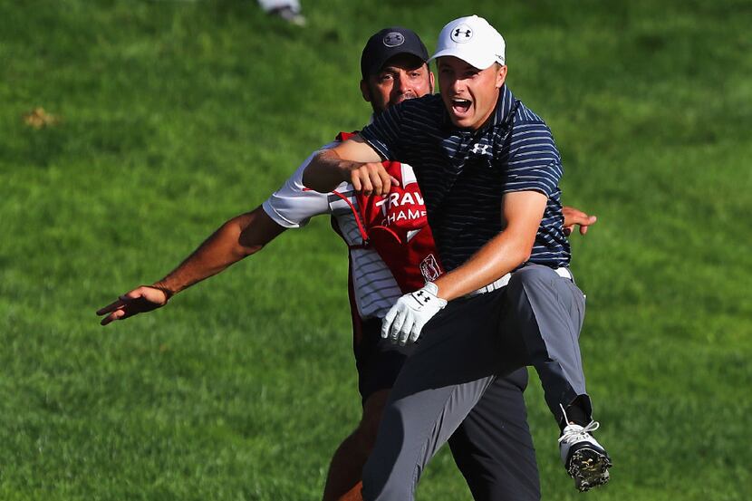 CROMWELL, CT - JUNE 25:  Jordan Spieth of the United States celebrates with caddie Michael...