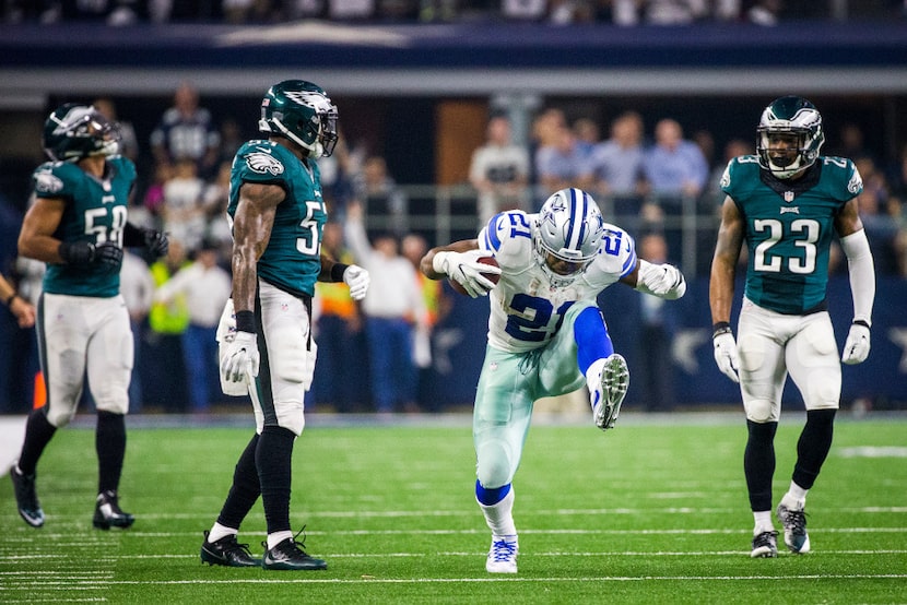 Dallas Cowboys running back Ezekiel Elliott (21) celebrates after picking up a first down...