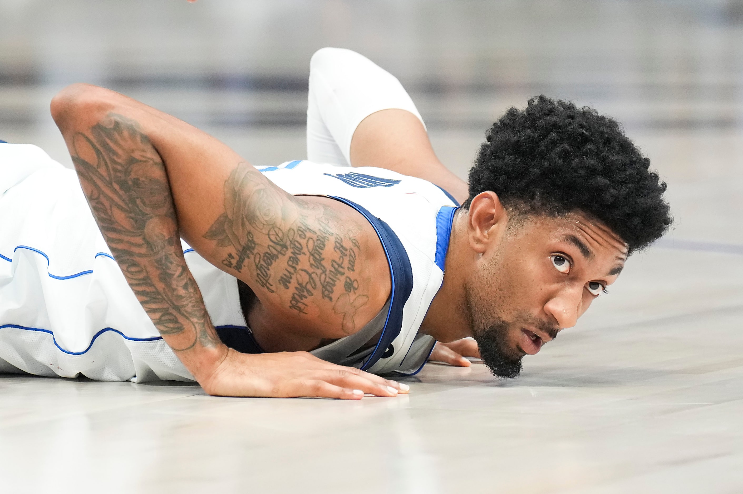 Dallas Mavericks center Christian Wood (35) looks up from the floor after being fouled...