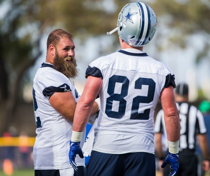 Dallas Cowboys center Travis Frederick (72) talks to tight end Jason Witten (82) during an...