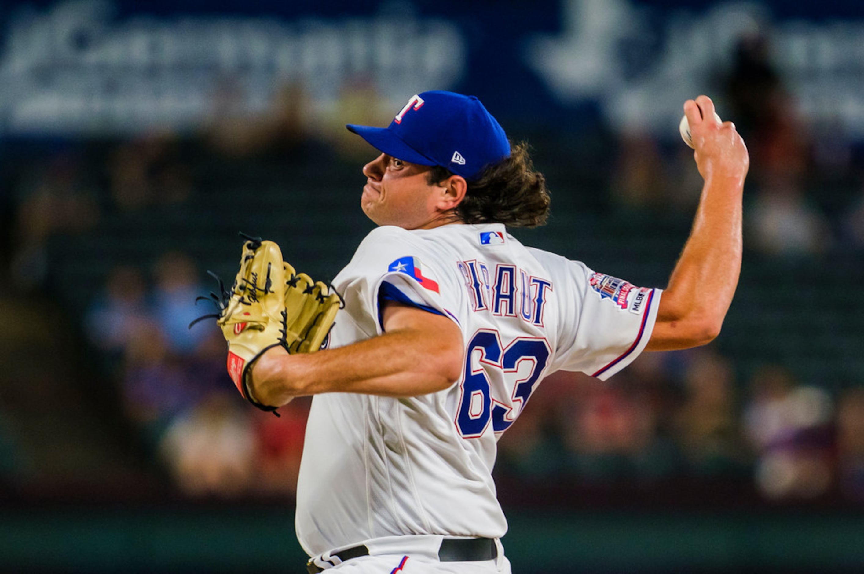 Texas Rangers relief pitcher Ian Gibaut (63) pitches during the seventh inning against the...
