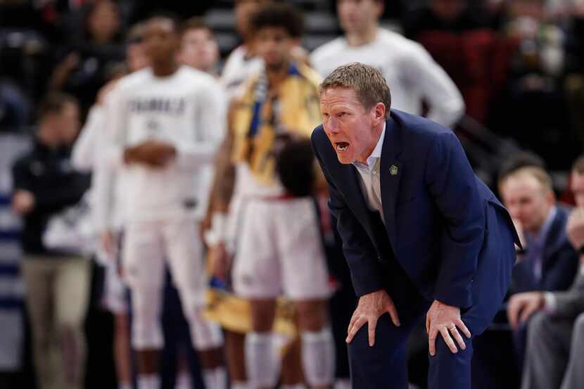 Gonzaga coach Mark Few stands along the sideline during the first half of a first-round game...