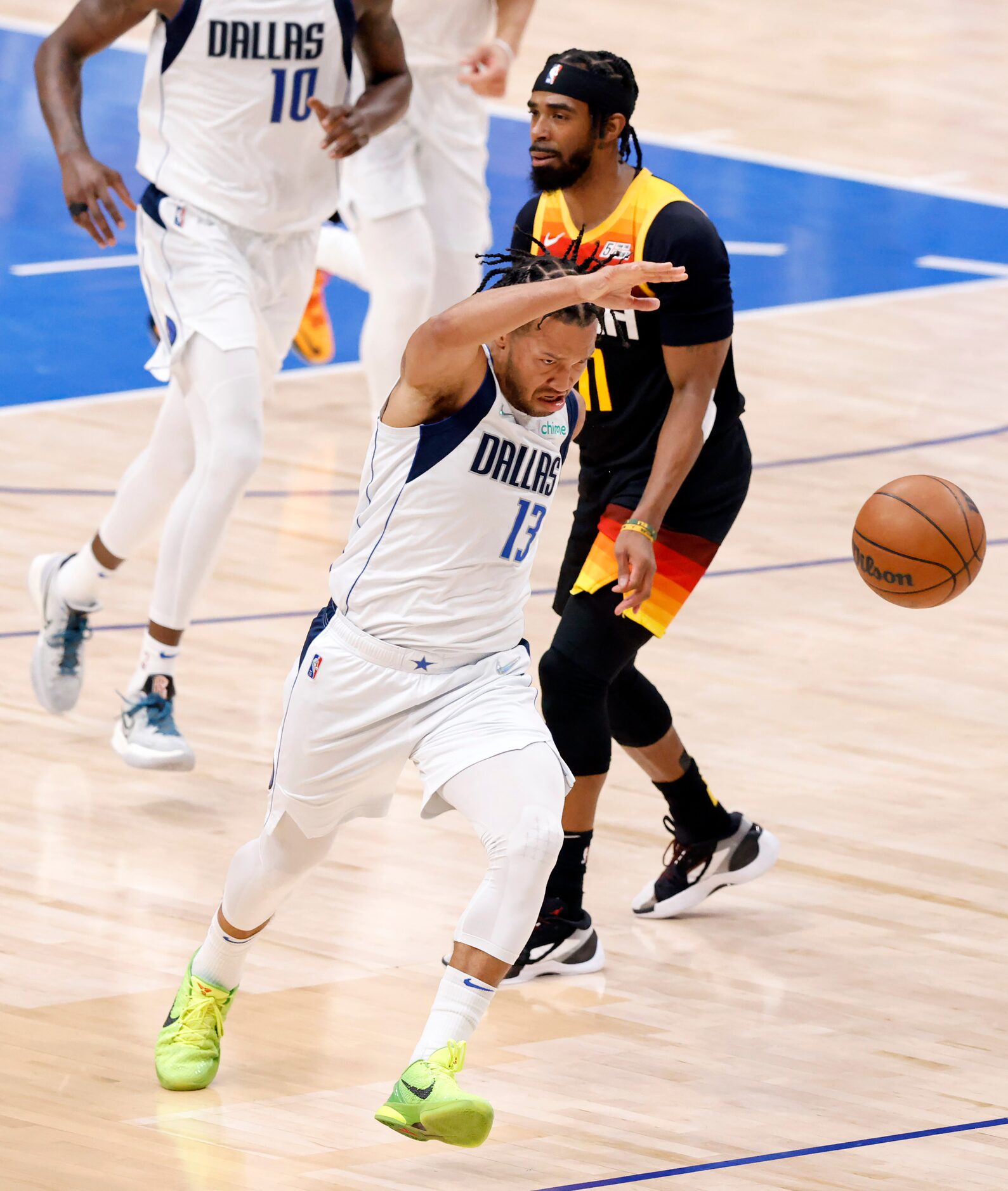 Dallas Mavericks guard Jalen Brunson (13) is fouled across the face by Utah Jazz guard Mike...